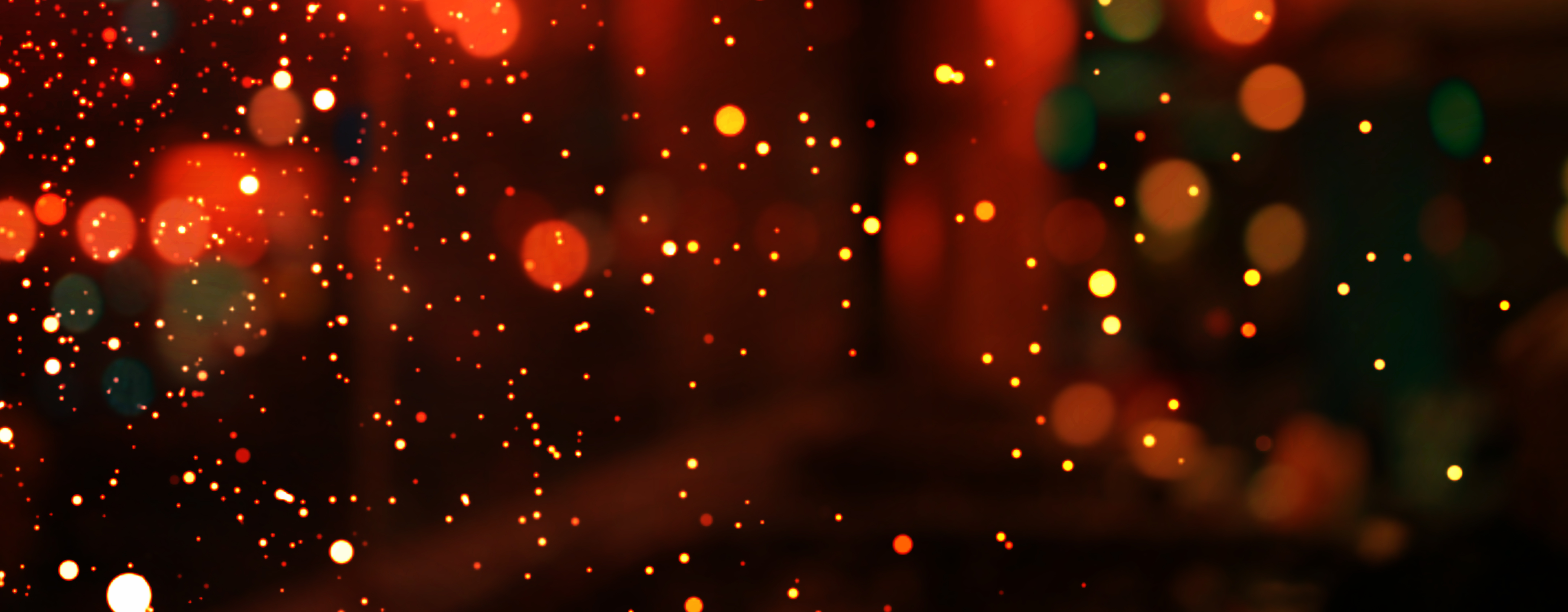 Abstract Christmas glitter lights background. Blurred Christmas and New Year light.