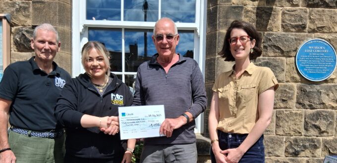 Cheque being handed over to MCO
